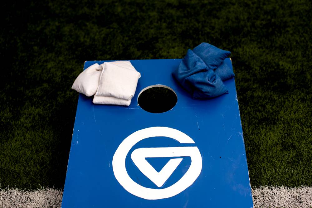 Cornhole board with the "GV" symbol